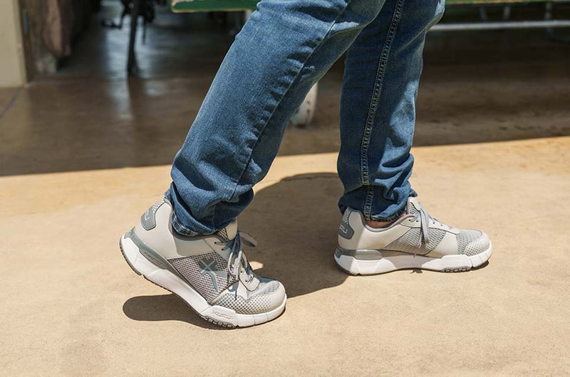KURU Footwear Man walking In QUANUM shoes in color SlateGray